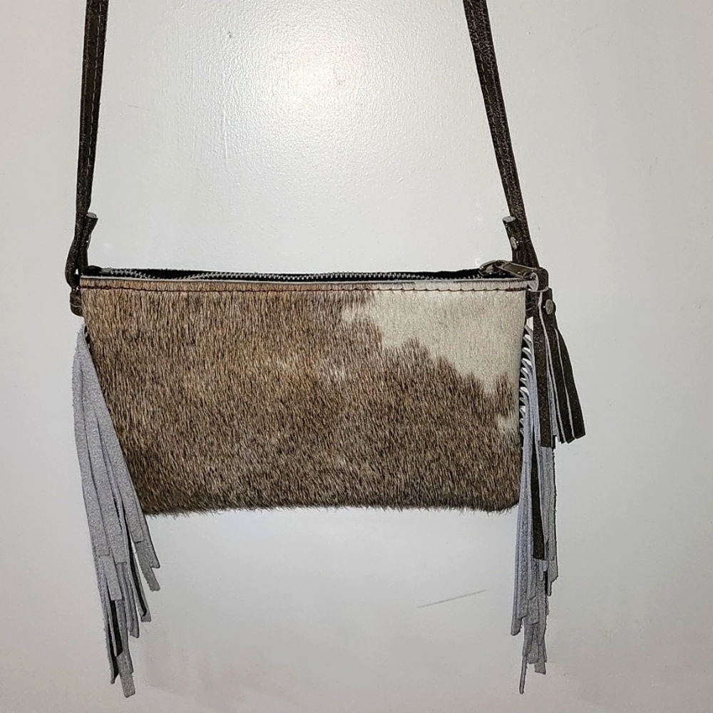 Women's cowhide brown and cream cross body purse with fringe new without tags
